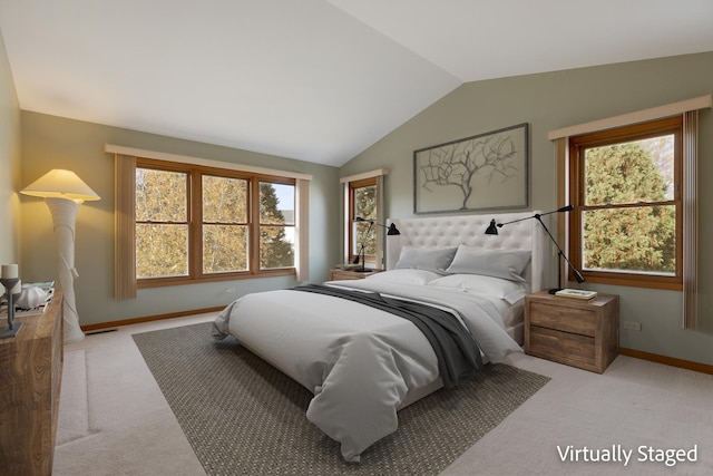 bedroom with light colored carpet, vaulted ceiling, visible vents, and baseboards