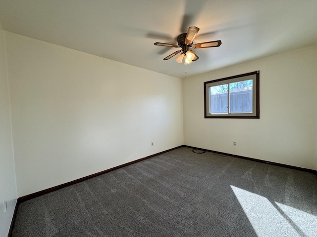 spare room featuring a ceiling fan, baseboards, and carpet flooring