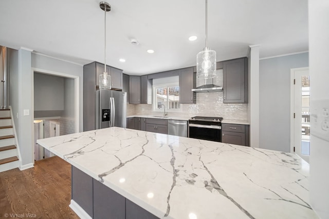 kitchen featuring hanging light fixtures, appliances with stainless steel finishes, and gray cabinets