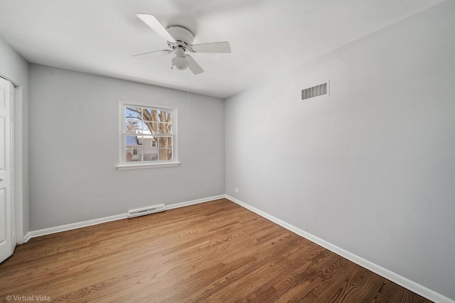 unfurnished bedroom with a ceiling fan, light wood-type flooring, visible vents, and baseboards