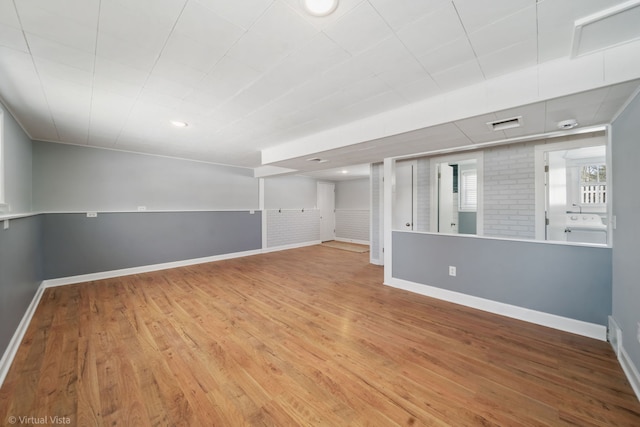 interior space featuring recessed lighting, wood finished floors, and baseboards