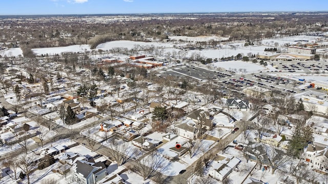 snowy aerial view featuring a residential view