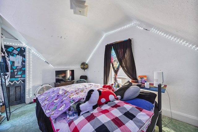 carpeted bedroom with lofted ceiling, a textured ceiling, and baseboards