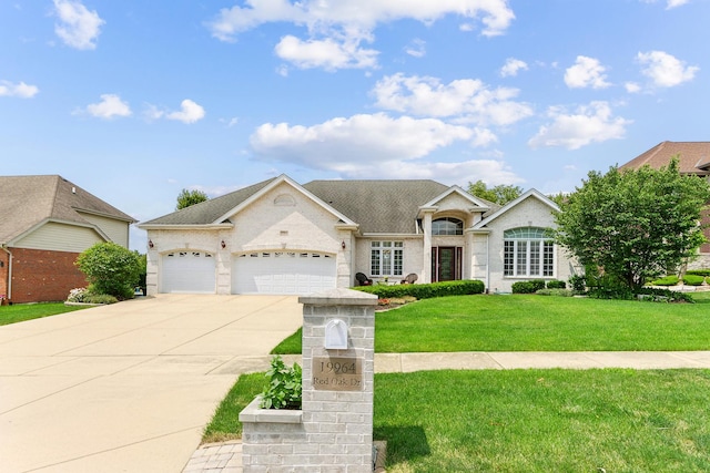 single story home featuring a garage and a front yard