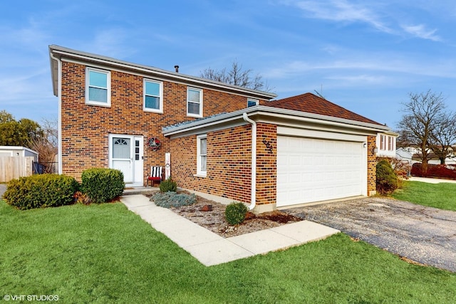 view of front property with a garage and a front lawn