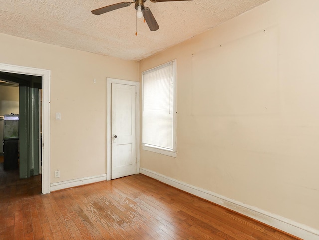 6333 S Talman Ave, Chicago, IL 60629 - empty room with hardwood / wood-style floors, a textured ceiling, and ceiling fan