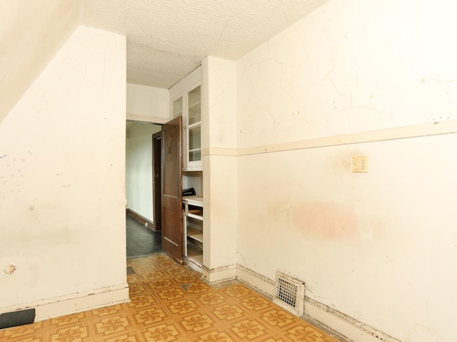 6333 S Talman Ave, Chicago, IL 60629 - spare room with a textured ceiling