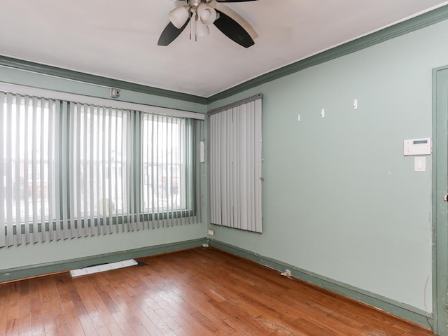 6333 S Talman Ave, Chicago, IL 60629 - empty room featuring hardwood / wood-style floors, ornamental molding, and ceiling fan