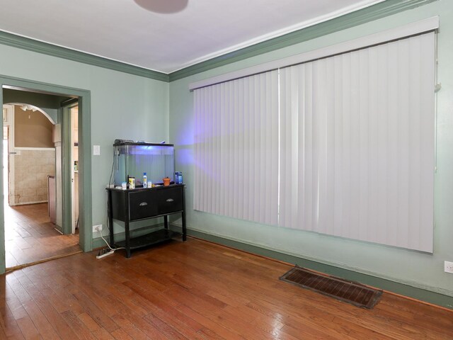 6333 S Talman Ave, Chicago, IL 60629 - empty room with crown molding and hardwood / wood-style flooring