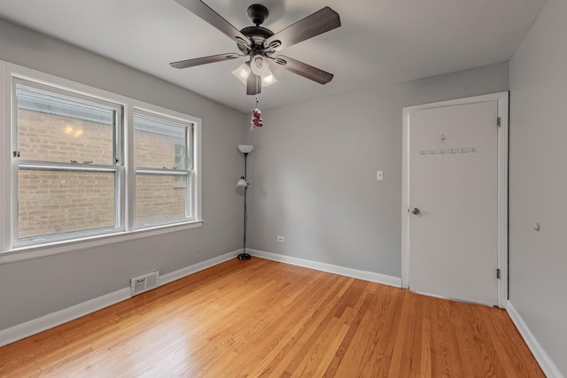 unfurnished room with ceiling fan and light hardwood / wood-style flooring