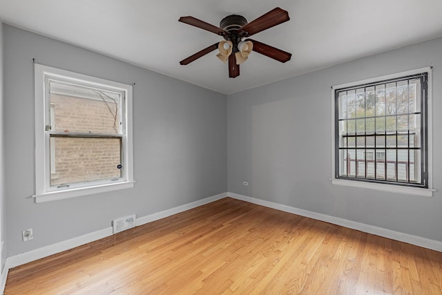 empty room with light hardwood / wood-style flooring and ceiling fan