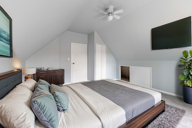 bedroom with vaulted ceiling, light carpet, and ceiling fan