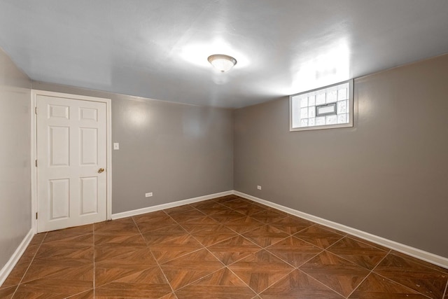 basement with dark parquet flooring