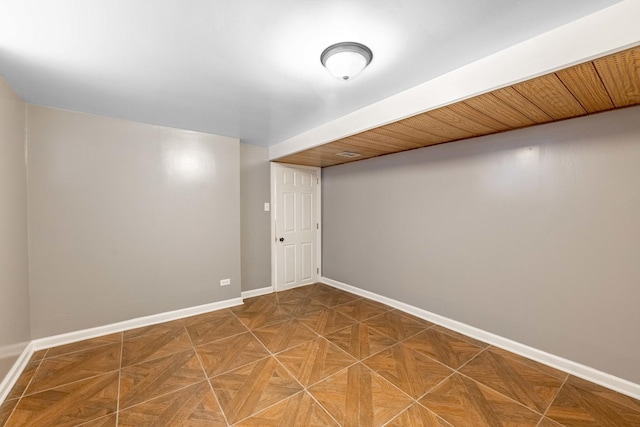 basement featuring parquet flooring