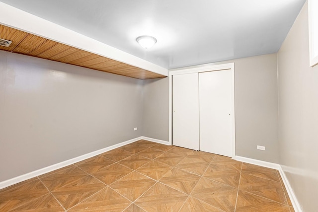 basement featuring light parquet flooring