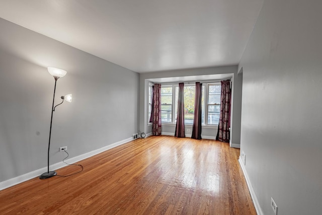 unfurnished room featuring light hardwood / wood-style floors