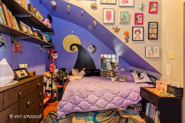 bedroom with wood finished floors