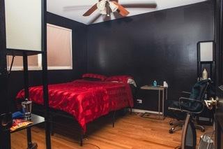 bedroom with hardwood / wood-style flooring