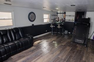 living room featuring dark wood-type flooring