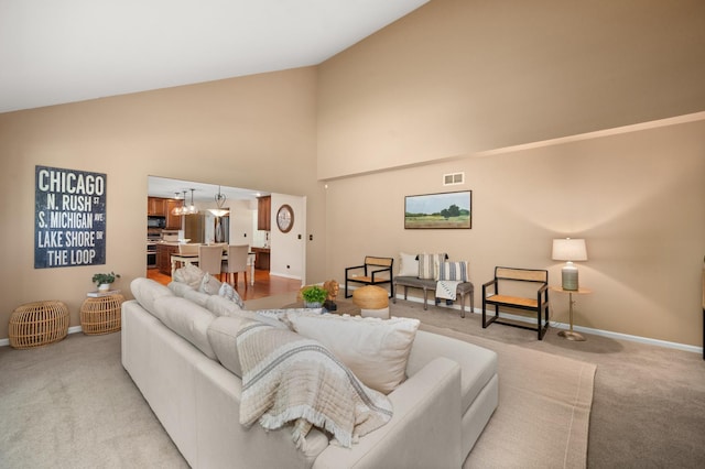 3444 Owens Ln, Dekalb, IL 60115 - living room featuring light colored carpet and high vaulted ceiling