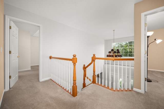 3444 Owens Ln, Dekalb, IL 60115 - corridor with an upstairs landing, carpet flooring, and a chandelier