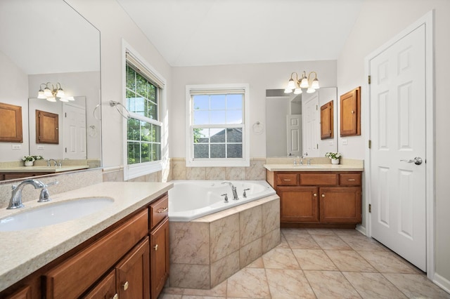 3444 Owens Ln, Dekalb, IL 60115 - bathroom with vaulted ceiling, a chandelier, two vanities, a garden tub, and marble finish flooring