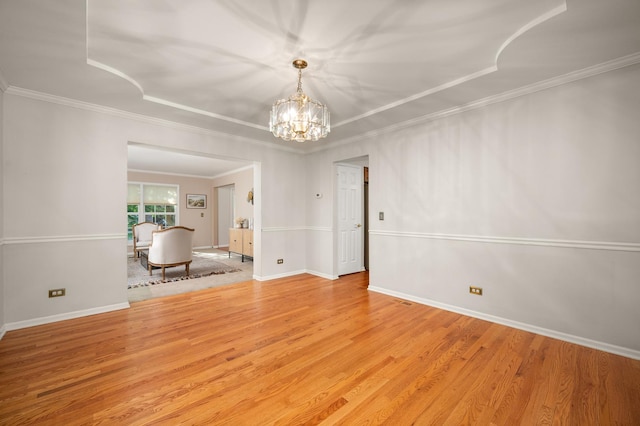 3444 Owens Ln, Dekalb, IL 60115 - spare room with a chandelier, wood finished floors, and ornamental molding