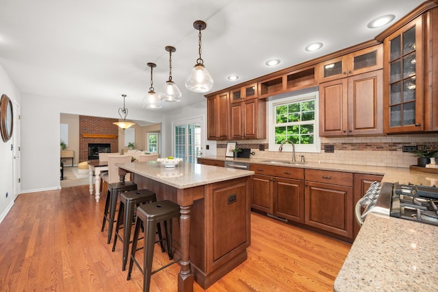 3444 Owens Ln, Dekalb, IL 60115 - kitchen with a center island, brown cabinetry, backsplash, and recessed lighting