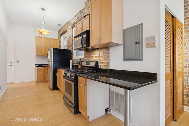 kitchen with stainless steel appliances, light wood-style flooring, decorative backsplash, light brown cabinets, and electric panel