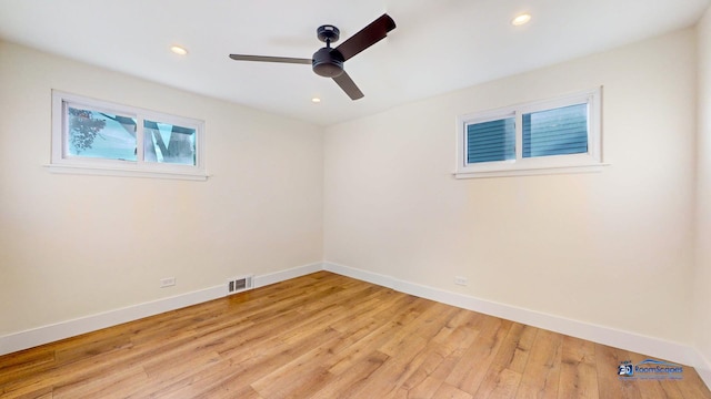 empty room with light hardwood / wood-style floors and ceiling fan