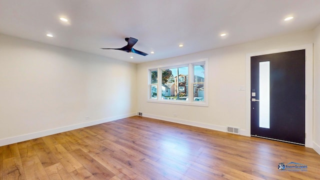 entrance foyer featuring light hardwood / wood-style flooring and ceiling fan