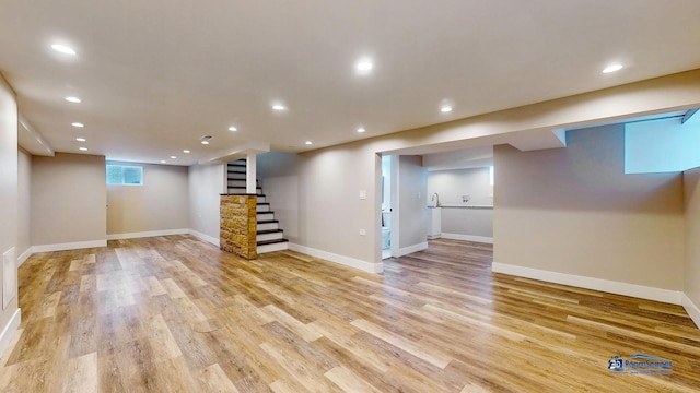 basement featuring light wood-type flooring