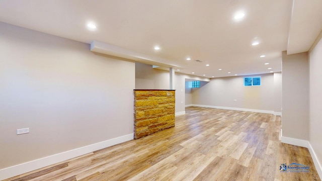 basement featuring light wood-type flooring