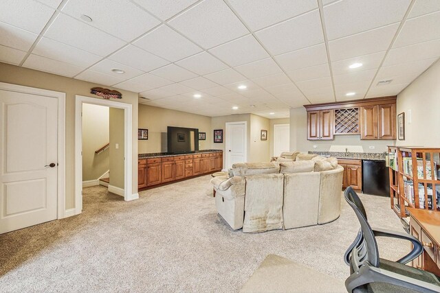 living area featuring baseboards, wet bar, light carpet, recessed lighting, and stairway