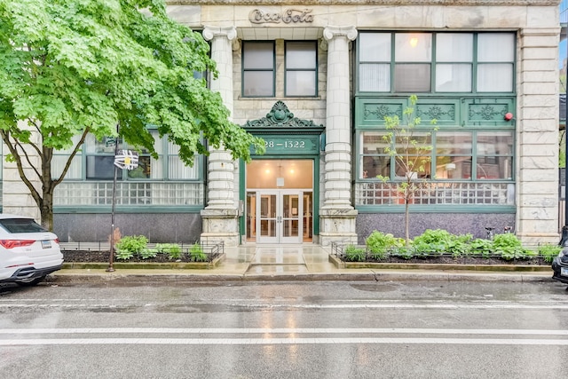 entrance to property featuring french doors