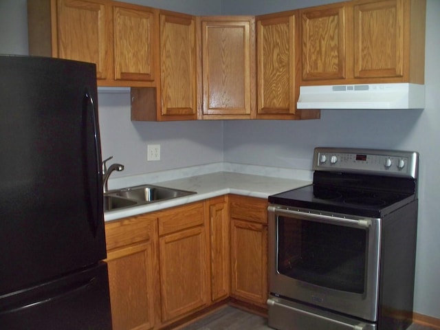 1357 Monomoy St Unit B1, Aurora, IL 60506 - kitchen with black refrigerator, sink, and stainless steel electric range