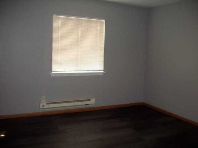 1357 Monomoy St Unit B1, Aurora, IL 60506 - unfurnished room featuring dark wood-type flooring and baseboard heating