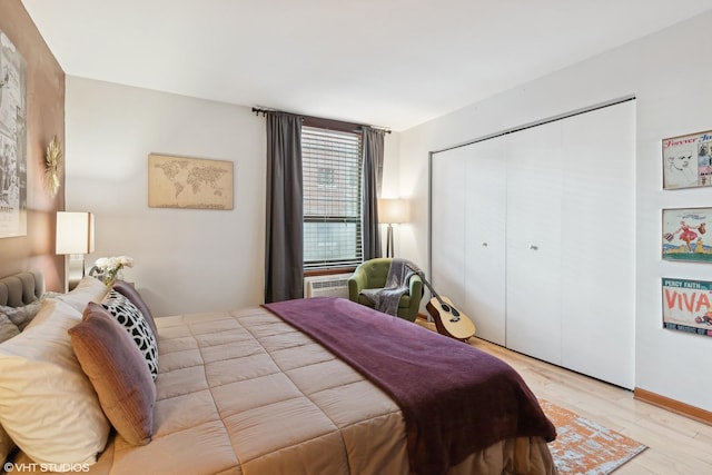 bedroom featuring a closet and light wood-type flooring