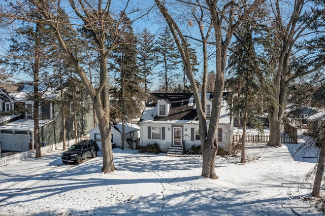 view of front of property with fence and a residential view