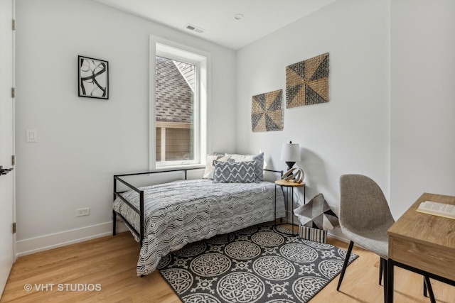 bedroom with wood-type flooring