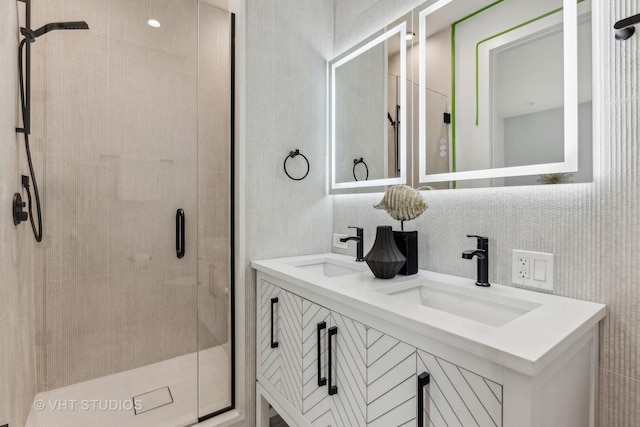 bathroom featuring a shower with door, vanity, and backsplash