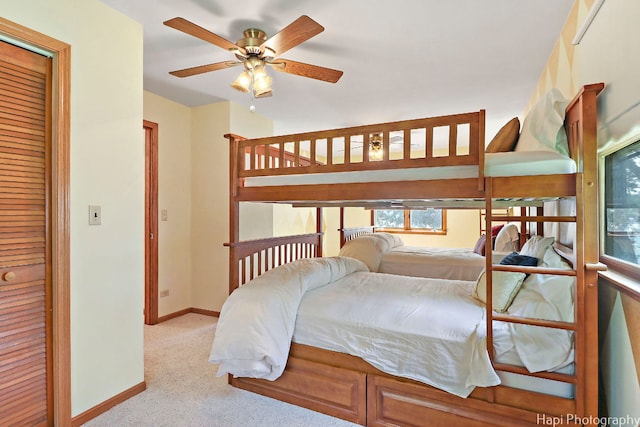 carpeted bedroom featuring a closet