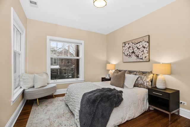 bedroom featuring dark hardwood / wood-style floors