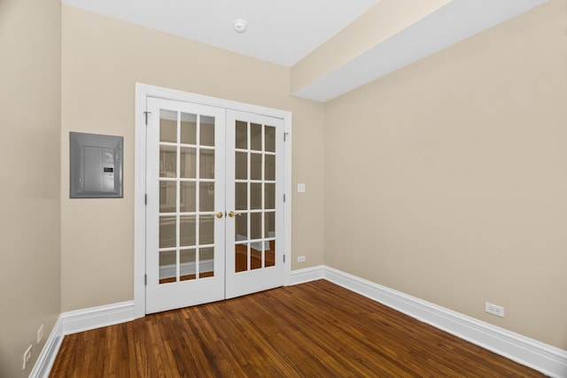 unfurnished room featuring french doors, electric panel, and hardwood / wood-style floors