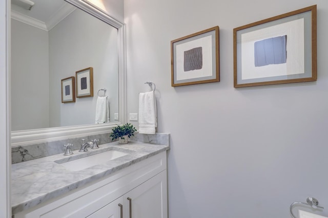 bathroom featuring vanity and ornamental molding