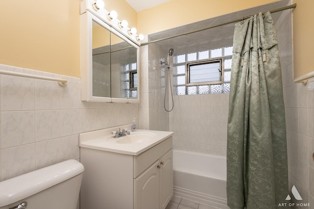 full bathroom featuring tile walls, vanity, toilet, and shower / bath combo with shower curtain