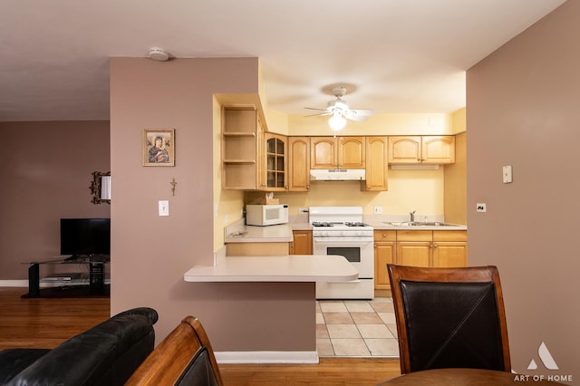 kitchen featuring sink, ceiling fan, light brown cabinets, white appliances, and light hardwood / wood-style flooring