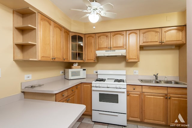 kitchen with sink, white appliances, ceiling fan, and light tile patterned flooring