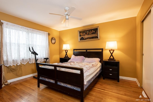 bedroom featuring ceiling fan and light hardwood / wood-style floors