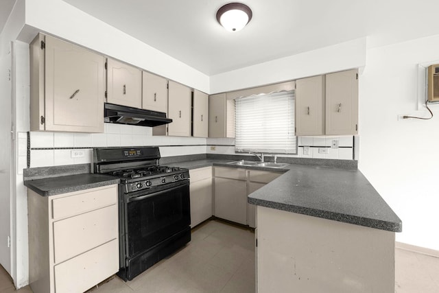 kitchen featuring tasteful backsplash, sink, light tile patterned floors, kitchen peninsula, and gas stove